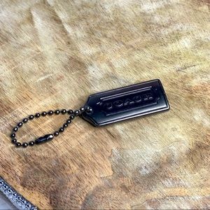Black metal Coach hangtag